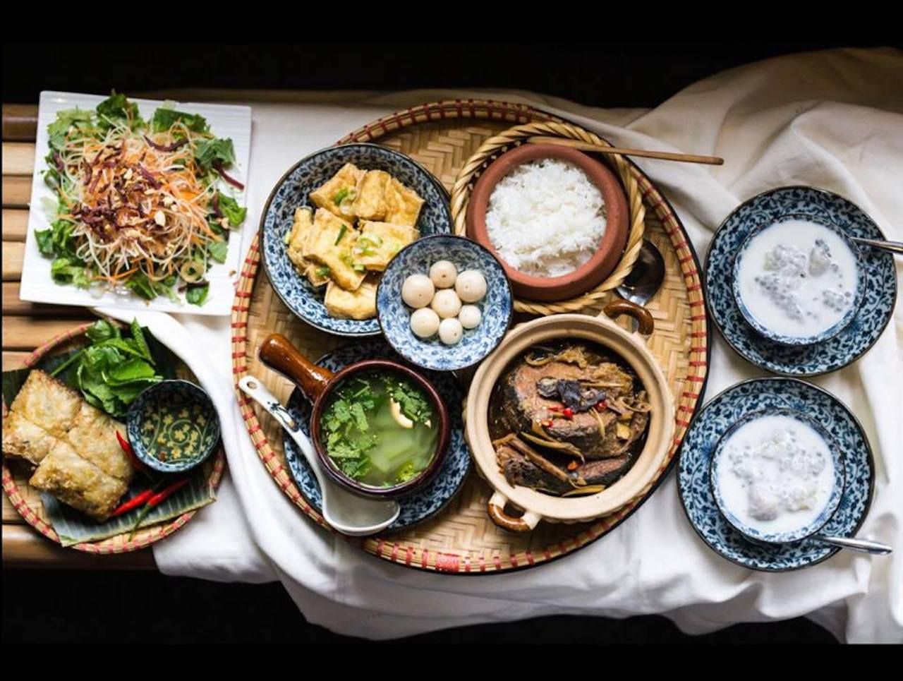 Table set with lots of Vietnamese dishes